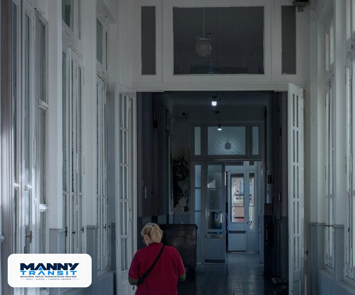 Calm, secure hallway inside a behavioral health facility during a client transfer