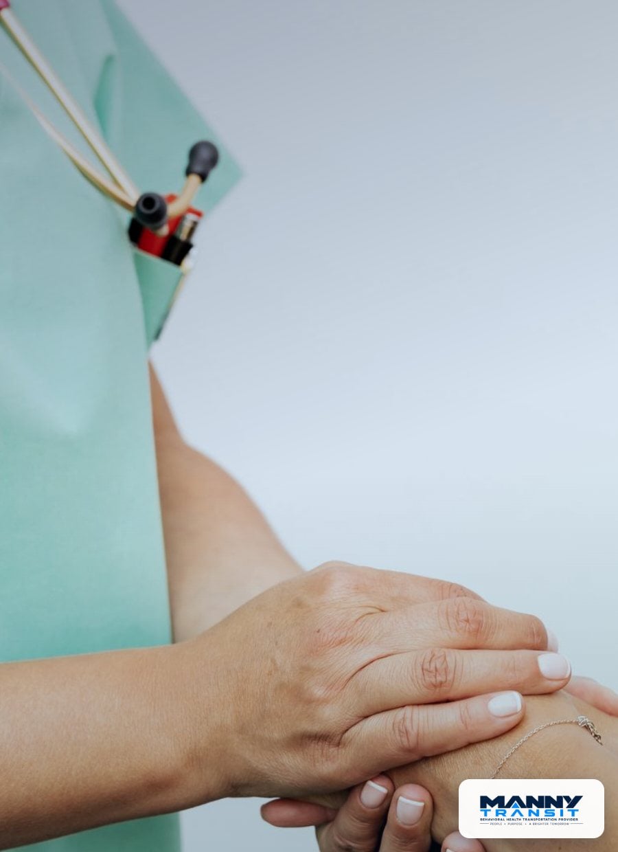 Caregiver holding a patient's hands