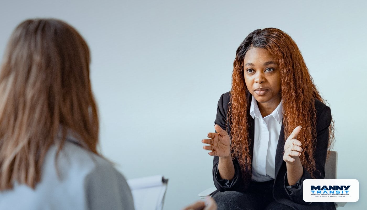 Behavioral health professional in a supportive conversation at a crisis stabilization unit